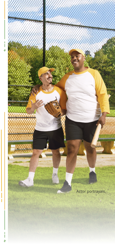 2 men walking with baseball gear (actor portrayals)