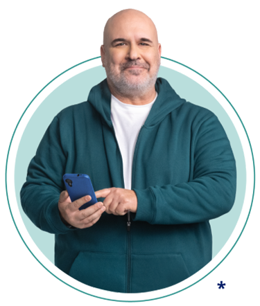 Man in blue sweatshirt pointing at a cellphone