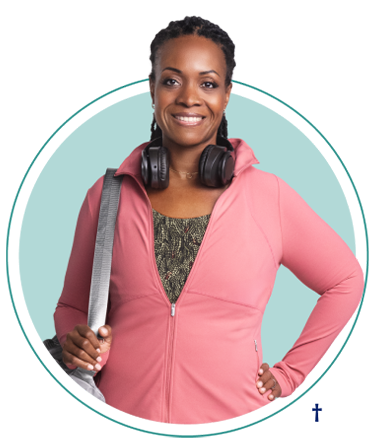 Woman in pink shirt holding a handbag and headphones