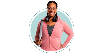 Woman in pink shirt holding a handbag and headphones