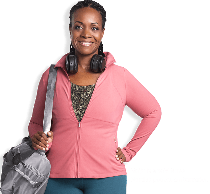 Maija wearing pink sweatshirt and purse